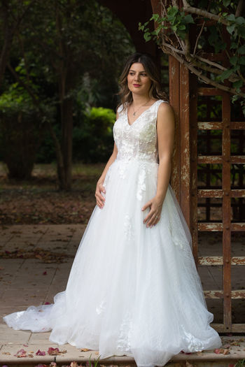 Portrait of bride standing on field