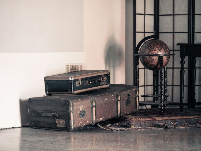 Old suitcase on floor