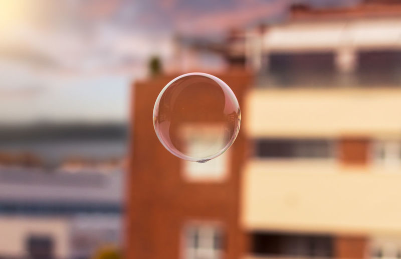 Close-up of bubble in mid-air against building