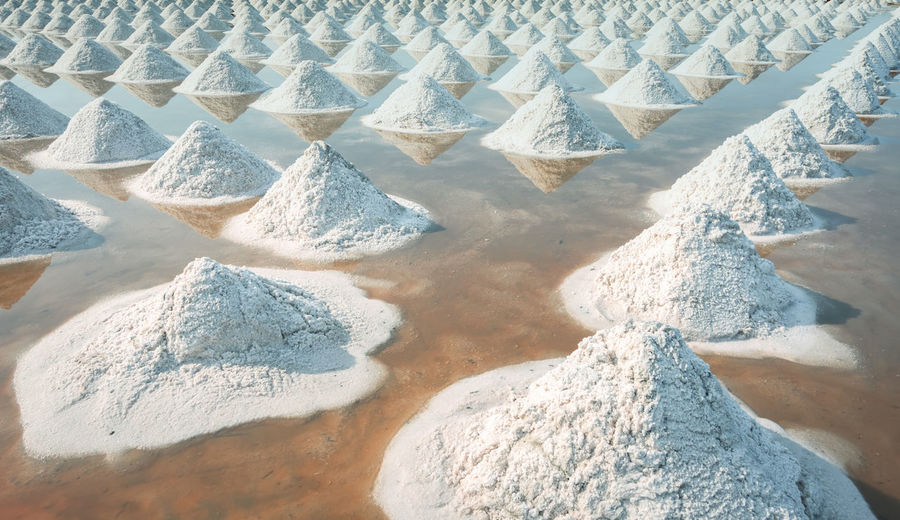 Brine salt farm at samut sakhon, thailand. organic sea salt. evaporation and crystallization.