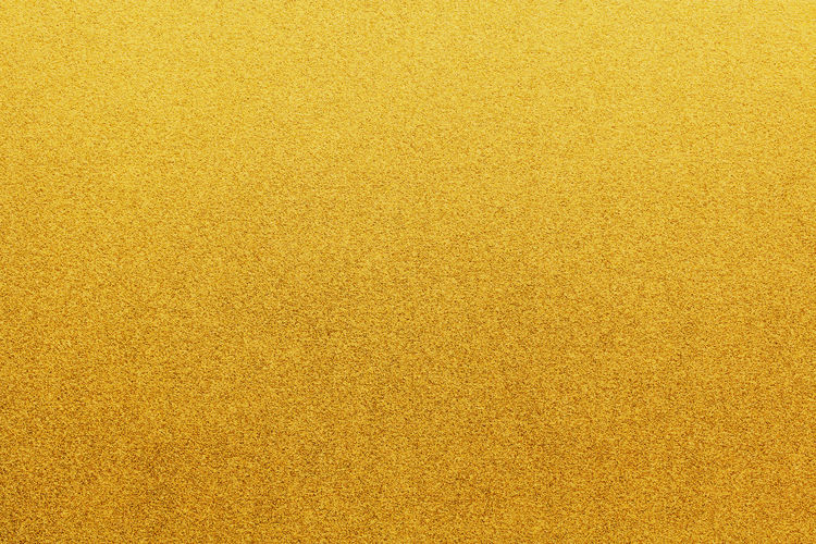 Gold color glitter paper abstract, natural grunge texture background