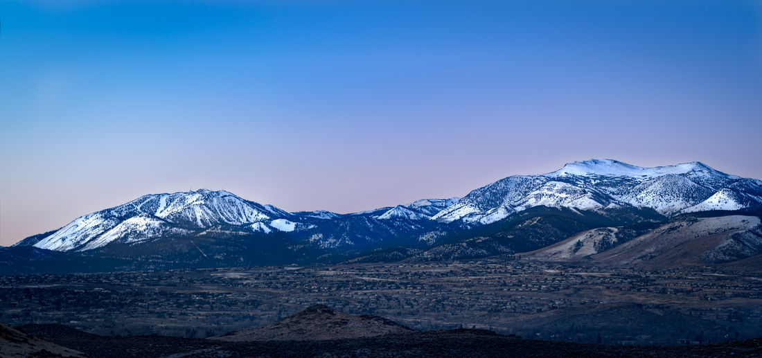 Panoramic view of the sierra nevada mountains above reno, nevada at sunrise 2021
