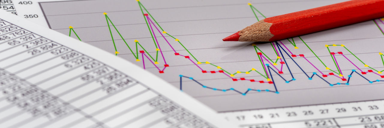 Financial chart and account with red pencil