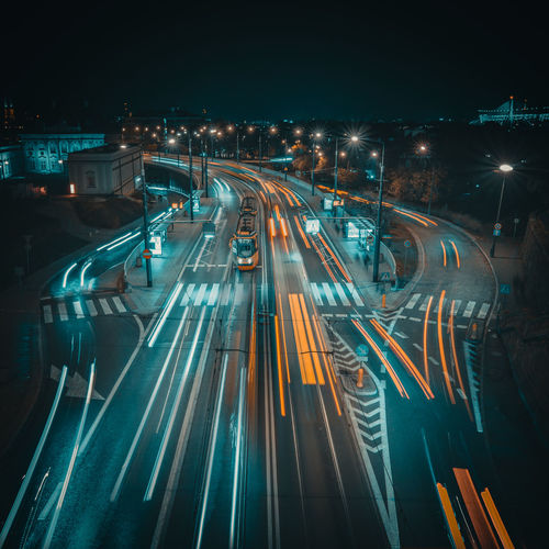 High angle view of light trails on road at night