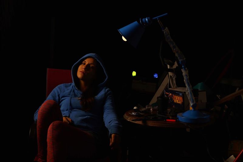 Young woman sitting on stage
