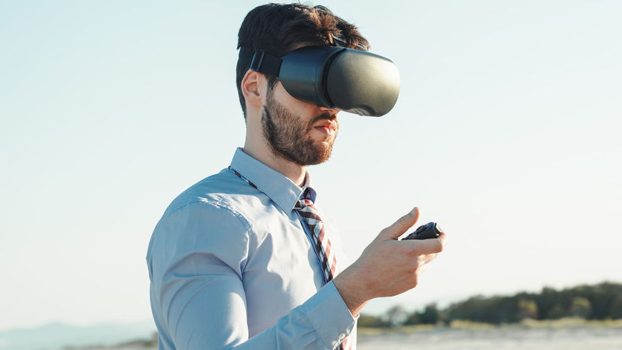 Businessman with augmented reality viewer
