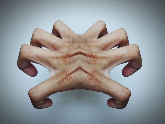 Digitally generated image of fingers over white background