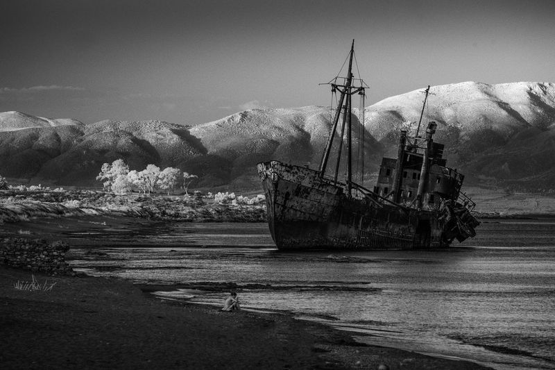 Dimitrios shipwreck at beach against mountains