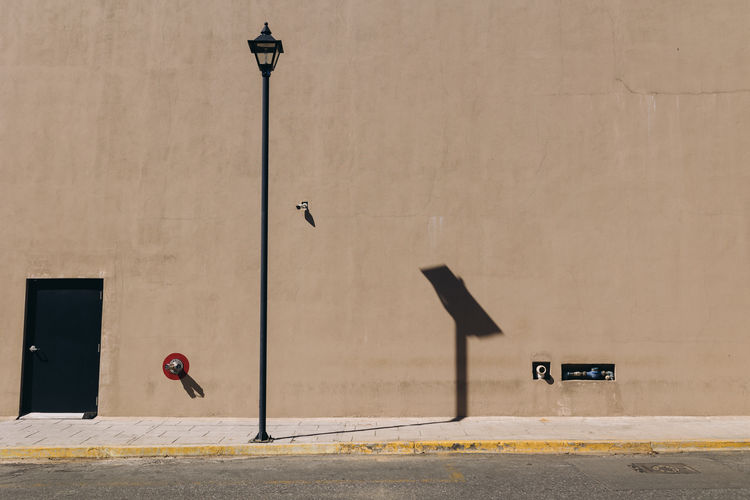 Minimalist facade of a modern building in oaxaca, mexico with a street light