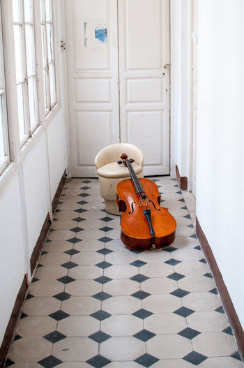 Close-up of guitar by chair