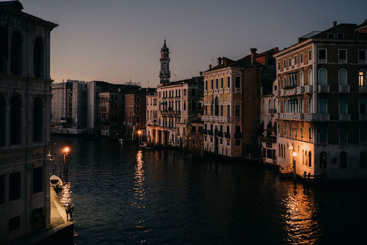Buildings in city of venice at night