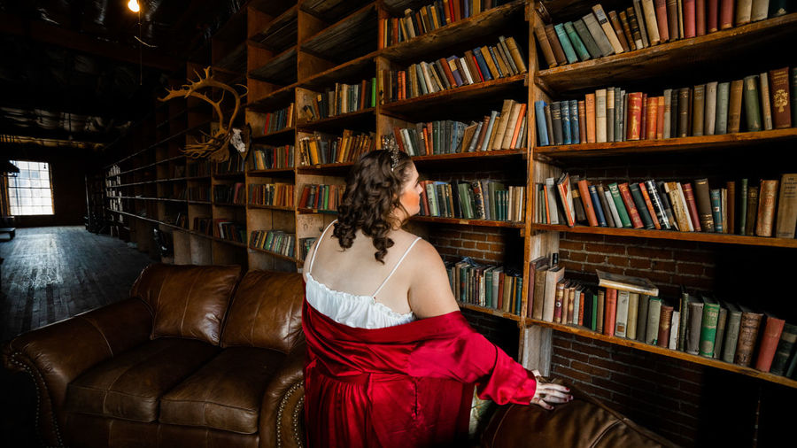 Portrait of woman standing in library