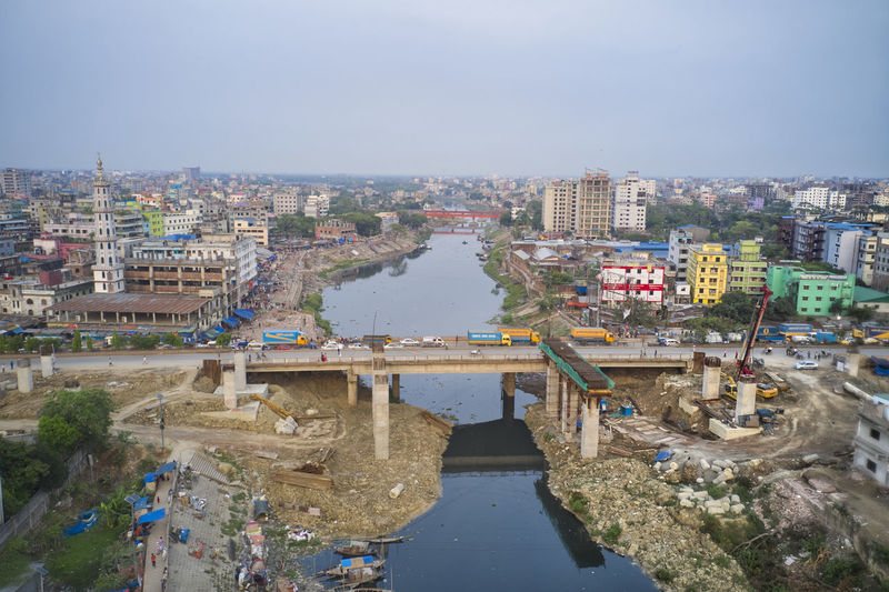 High angle view of river amidst buildings in city
