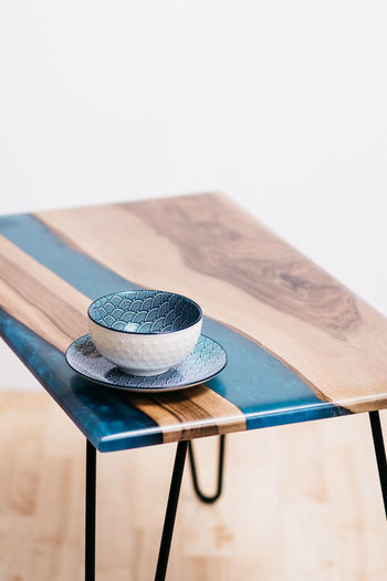 High angle view of hat on table against white background