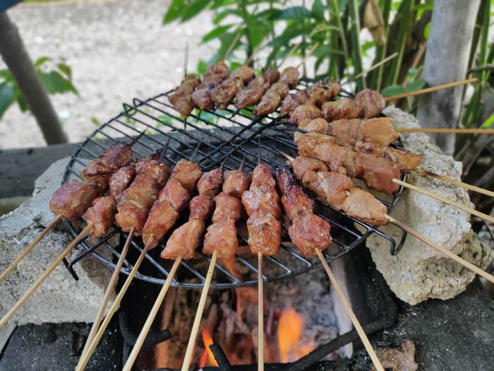 Close-up of meat on barbecue grill