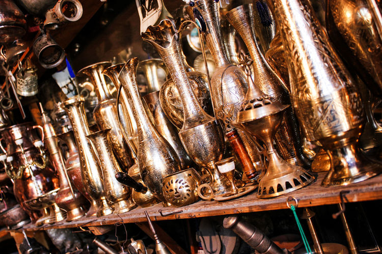 Close-up of antique utensils for sale in store