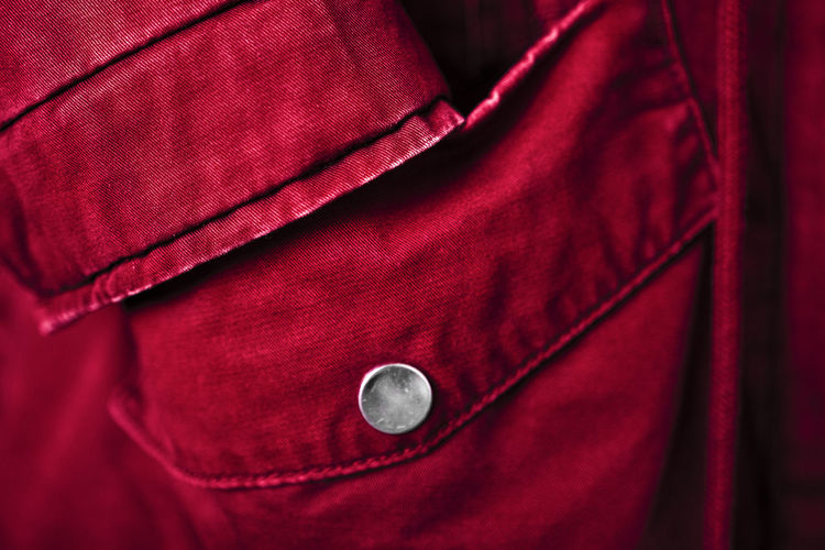 Outerwear in bright trendy color 2023 viva magenta. close-up of a textile background.