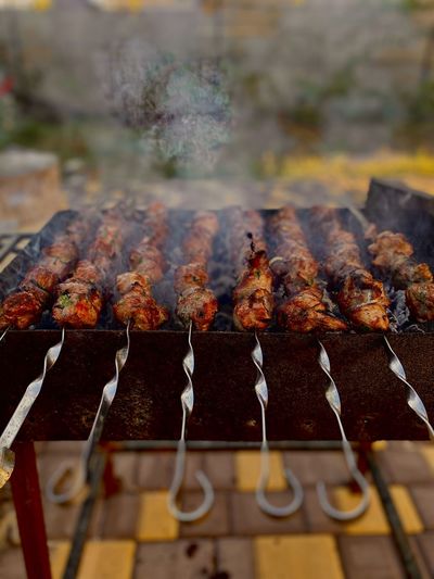 Close-up of meat on barbecue grill