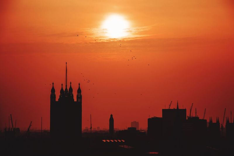 Silhouette of built structures at sunset