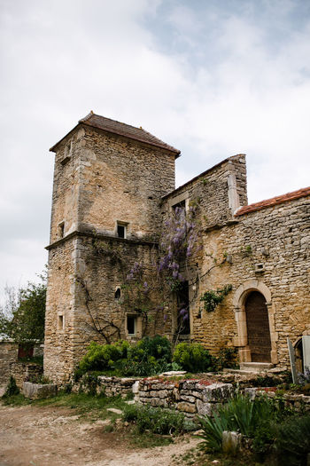 Stone building with wisteria in french countryside