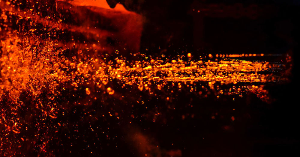 Full frame shot of illuminated fire in water at night
