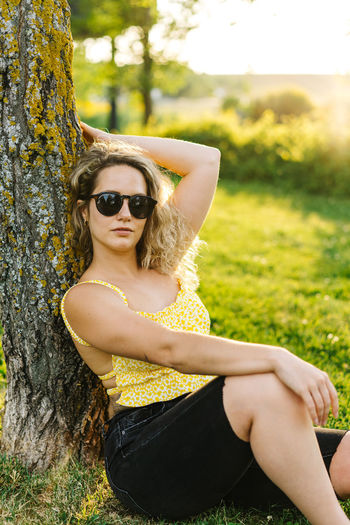 Portrait of young woman in sunglasses
