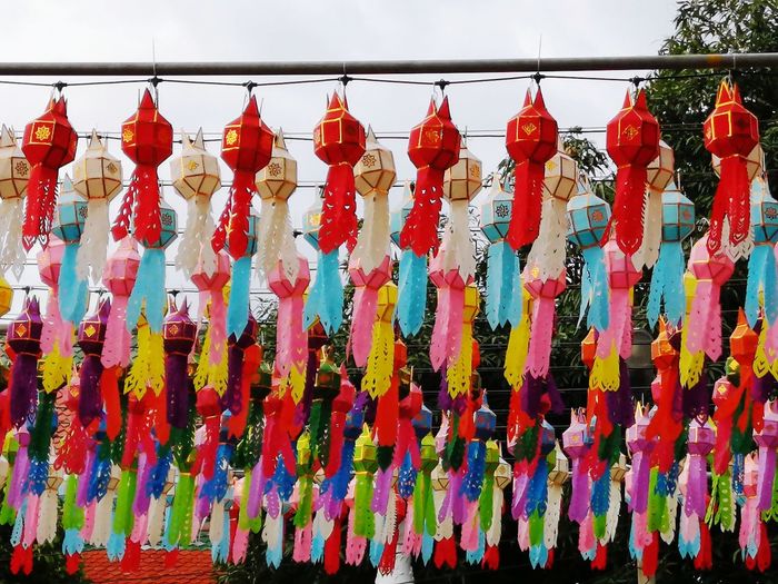 Multi colored umbrellas hanging outside temple
