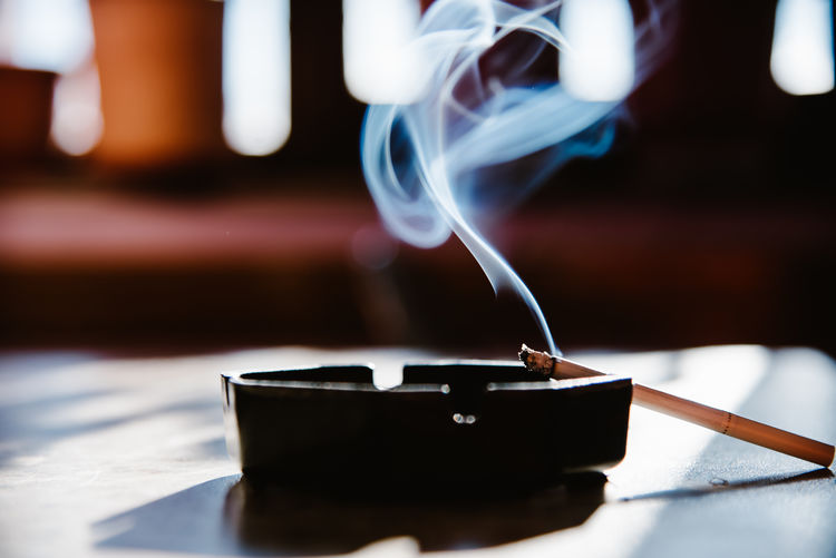 Close-up of cigarette on table