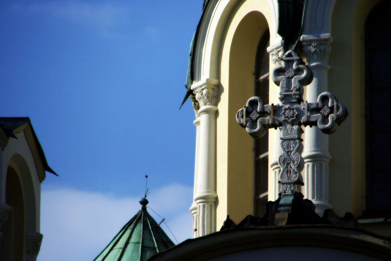 Low angle view of ornate building against blue sky