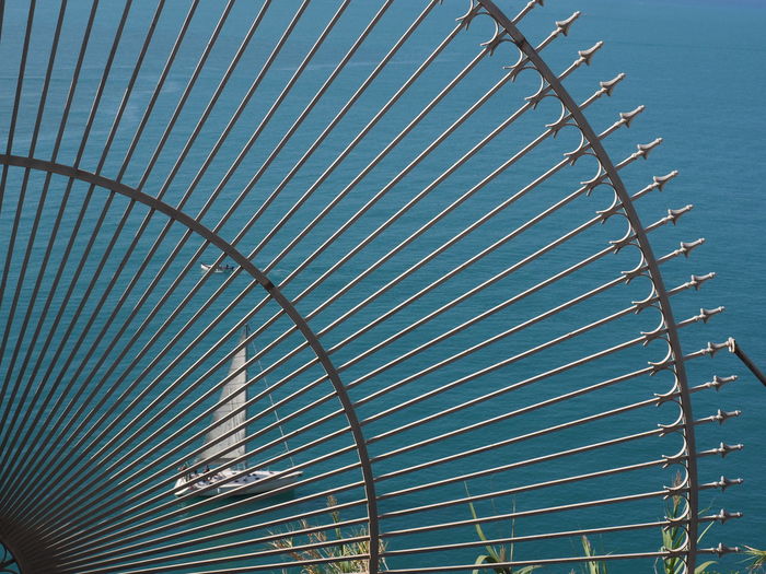 Sailboat behind the grid, porto venere, cinque terre