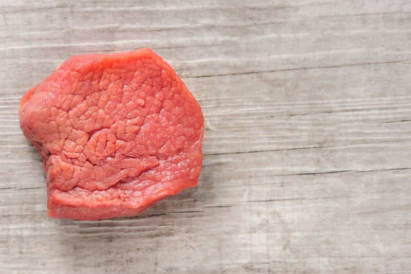 Close-up of raw steak on table