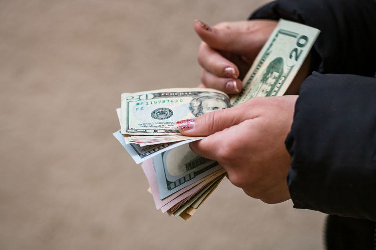 Close-up of hand holding paper