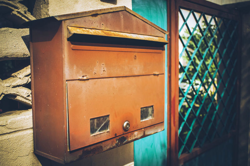 Close-up of mailbox on building wall