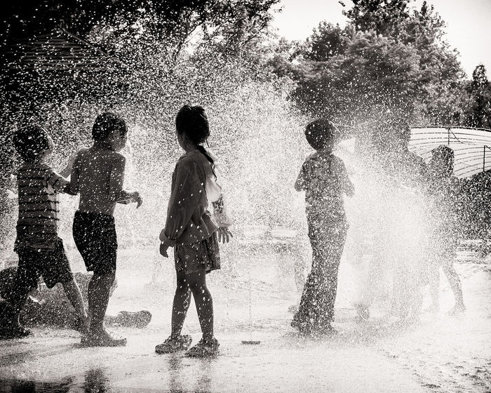Children playing in splashing water