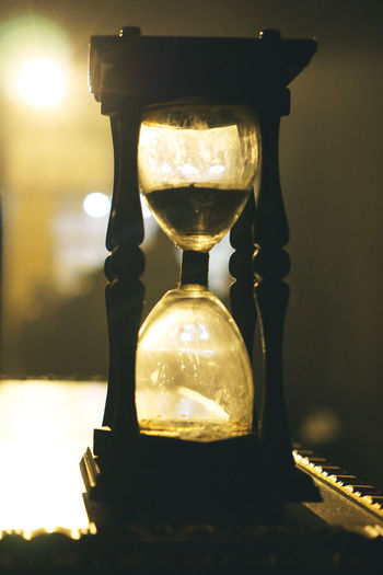 Close-up of hourglass on table