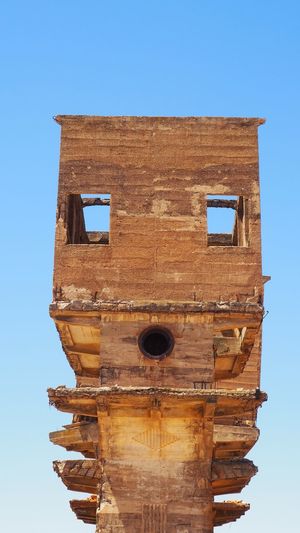 Low angle view of bell tower against clear sky