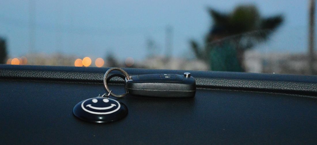 Close-up of car key on dashboard