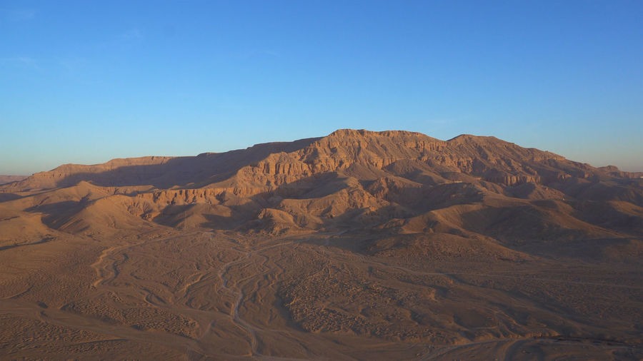 Luxor egypt panorama view riding hot air balloon over valley of the king sunrise aerial view video