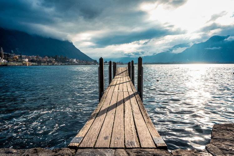 Pier over sea against sky
