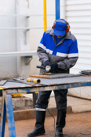 Low section of man working at construction site