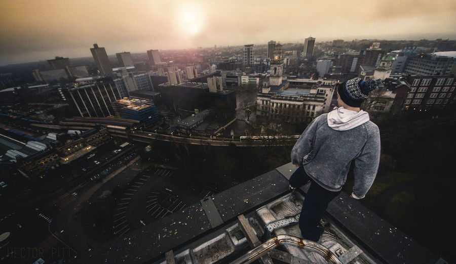 High angle view of man with cityscape in background