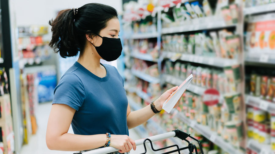 Young woman standing at store