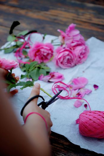 High angle view of pink rose flower on table