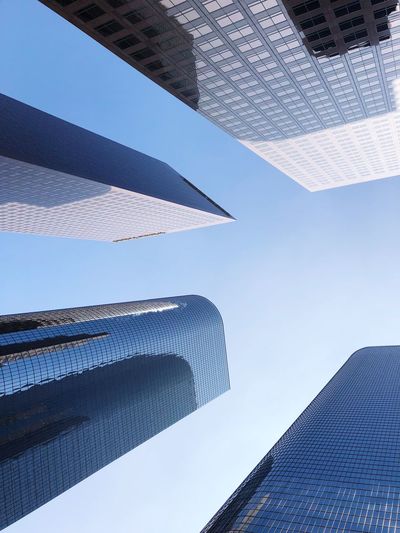 Low angle view of modern buildings against sky