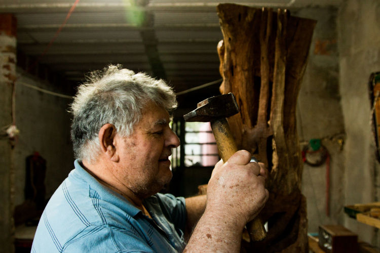 Senior man working at workshop