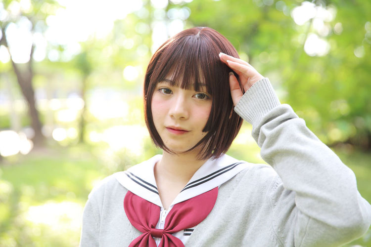 Portrait of beautiful young woman wearing japanese school uniform