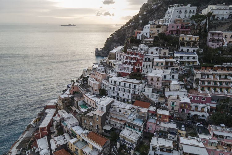 Italy, province of salerno, positano, drone view of hillside town on amalfi coast
