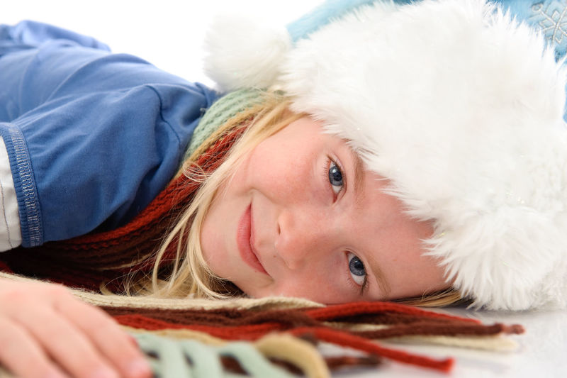 Close-up portrait of cute girl with hat
