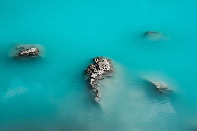 High angle view of rock in sea