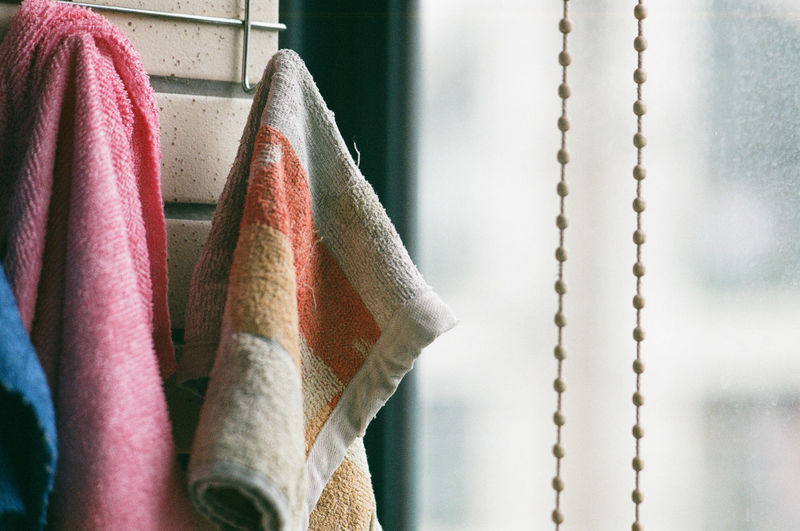 Close-up of clothes hanging on wall